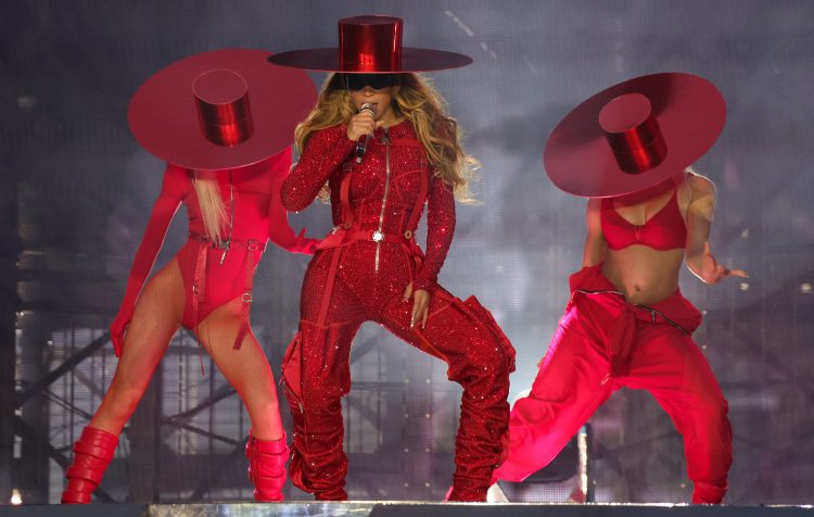 Beyoncé gives her sunglasses back to a fan after a security scuffle