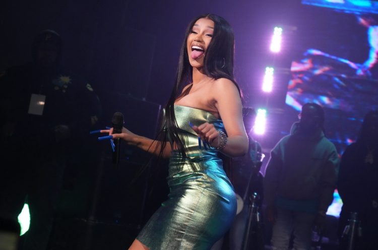 Watch Cardi B Get ‘Summer Jam Ready’ With Impressive Yoga Moves