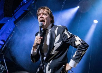 The Hives’ Pelle Almqvist cuts head while swinging microphone but finishes gig