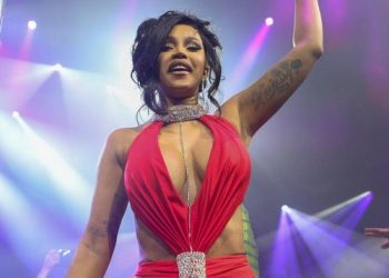 Cardi B throws microphone at fan who tossed drink at her