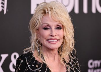 Dolly Parton Says She Has No Plans to Retire:  “I’ll Just Hopefully Drop Dead in the Middle of a Song Onstage”
