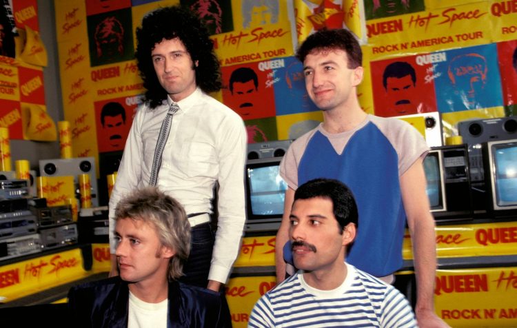 Brian May says John Deacon is still “very much part of Queen”