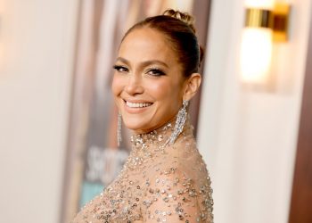 Jennifer Lopez Enjoys the Fourth of July Lounging in Pink Swimsuit