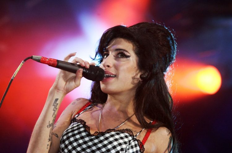 Amy Winehouse Is Alone in a Crowd in New ‘Tears Dry On Their Own’ Video Featuring Unseen Footage