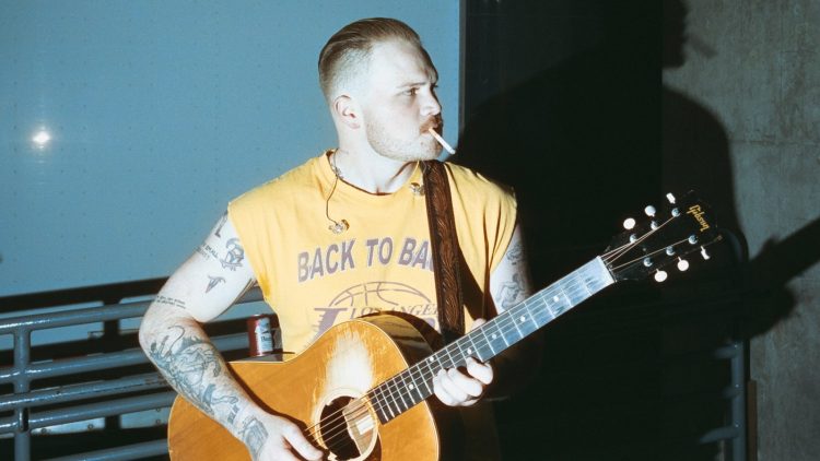 On Zach Bryan’s ‘The Great American Bar Scene,’ the Past is Tangled, the Future is Scary, and Right Now is Miller Time