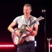 Coldplay’s Chris Martin Goes Undercover as Goofy Tourist To Record ‘All My Love’ Video at Las Vegas Karaoke Bar
