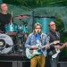 Weezer Will Still Play Coachella After Scott Shriner’s Wife Was Shot By Police